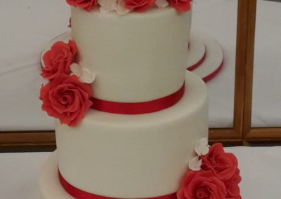 Wedding Cakes - 3 tiered wedding cake, handmade sugar roses and sugar bride and groom.
