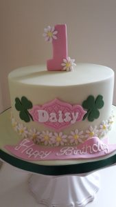 Daisy first birthday cake - bespoke design with flowers and clovers
