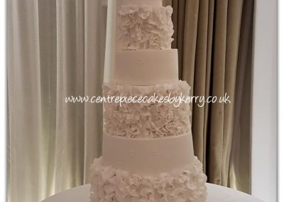 Tall 7 tier wedding cake with ruffles
